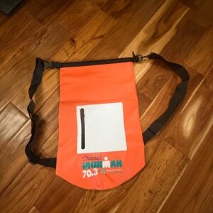 Iron Man 70.3 Indian Wells La Quinta Vibrant Orange Waterproof Backpack.